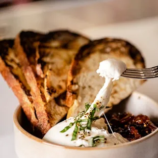 Burrata with cherry apricot mostarda and grilled sourdough on the appetizer menu.