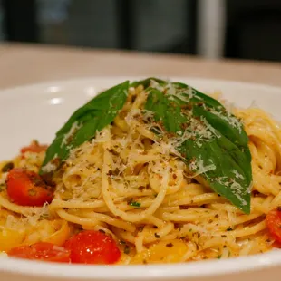 House-made spaghetti with ricotta, sungold tomatoes, basil and parmesan.