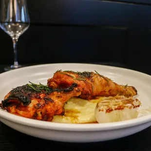 Roasted Amish half chicken, potato leek puree, roasted garlic and preserved lemon jus.