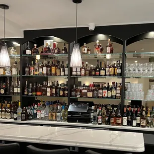 a bar with many bottles of alcohol