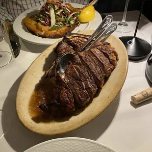 Sirloin steak and behind that, the Veal Milanese.