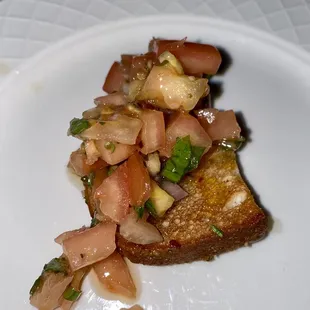  piece of toasted bread on a white plate