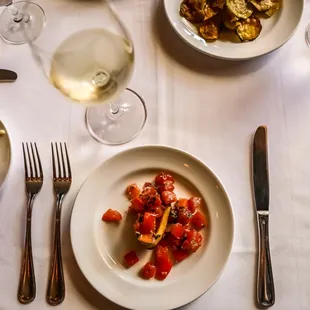 Bruschetta, Parmigiano, a glass of wine