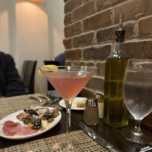 Cosmopolitan with eggplant and salami tapas.