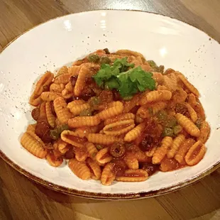 a pasta dish with meat and vegetables