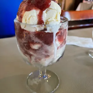 Strawberries Maria-a summer dessert of house prepared simmered strawberries in rum and brown sugar between layers of ice cream!