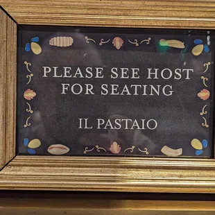 a sign that reads please see host for eating