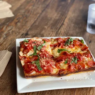 Detroit style pepperoni with red Chile flakes and basil.  Bon appetit!!