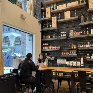 The walls had interesting bottles and jars with condiments.