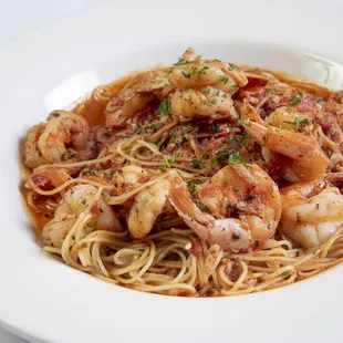 a plate of pasta with shrimp