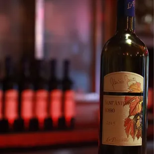 a bottle of wine on a bar