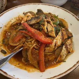 Scarparelli: Chicken and sausage with sautéed mushrooms, onions, and bell peppers in a marinade sauce over spaghetti.