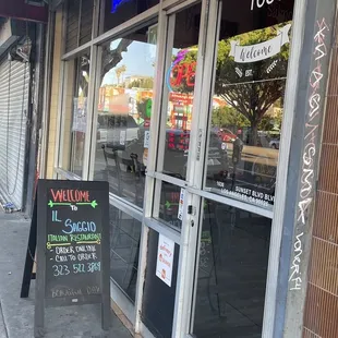 Small sign on the sidewalk