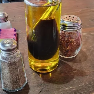 a shot of a glass of tea and spices on a table