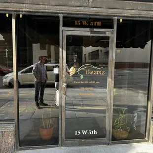 a man standing in front of a store