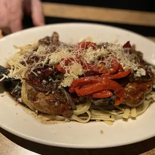 Pork Chops over linguini with red peppers, Sundried tomatoes, and Parmesan (no spinach)