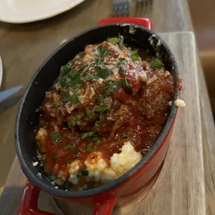 a dish of meat and mashed potatoes