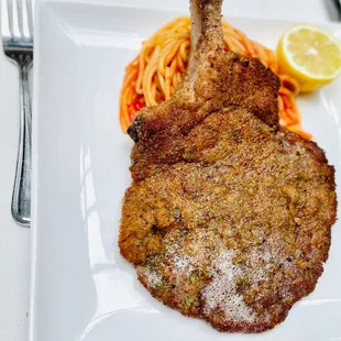 Costata Di Maiale Con Erbe Impanata! Bone in pork chop. Spaghettini Ortolano