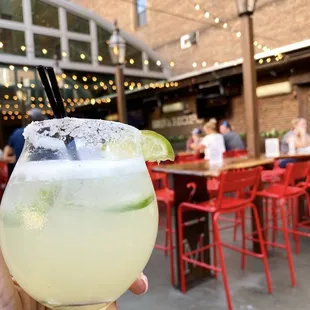 a hand holding a margarita