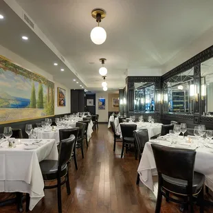a dining room with tables and chairs