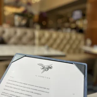 a menu on a table in a restaurant