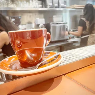 a cup of coffee on a saucer