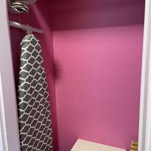 Ironing board, iron, safe and suitcase wracks in closet