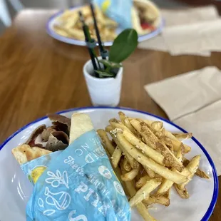 a plate of fries and a sandwich