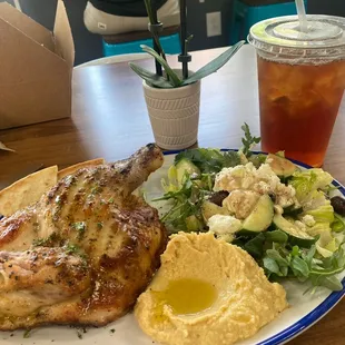Half bone in rotisserie Greek chicken plate, with two sides, I chose Greek salad and hummus