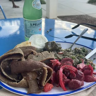 Lamb Gyro Plate with Cauliflower Lentil Salad, Beet Salad, and Grape Leaves.
