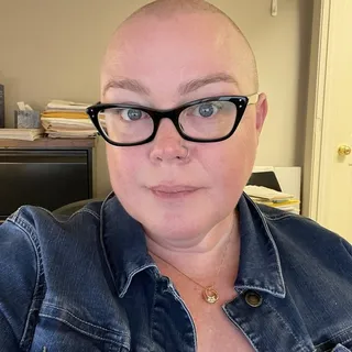 Laura E.