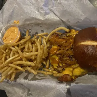 The Slinger on pretzel bun and fries