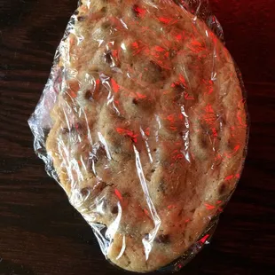 The half of my huge chocolate chip cookie that I'm taking to go!