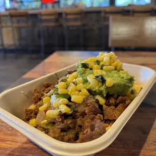 Breakfast bowl with chorizo and guacamole