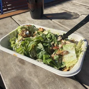 A salad with grilled chicken, beans, cheese, avocado and more...yum!