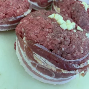 Bacon wrapped stuffed Juicy Lucy Burgers.