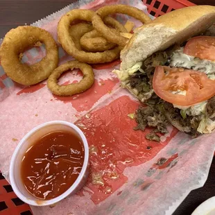 Philly Cheesesteak Sub with onion rings