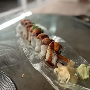 a sushi roll with shrimp and avocado