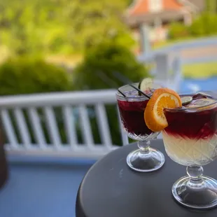 two glasses of wine on a table