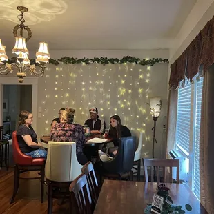 a group of people sitting around a table