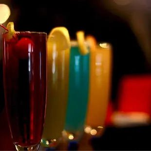 a row of cocktails