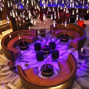 a circular bar with purple lighting