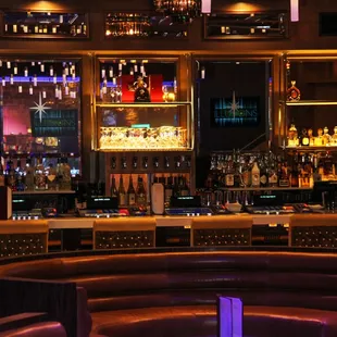 a bar with lots of bottles of alcohol
