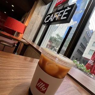 Iced Americano with a Denver backdrop