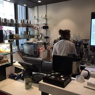 a man working in a coffee shop