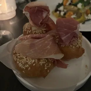 Savory Loukomades Shaved surryano ham, honey, sesame