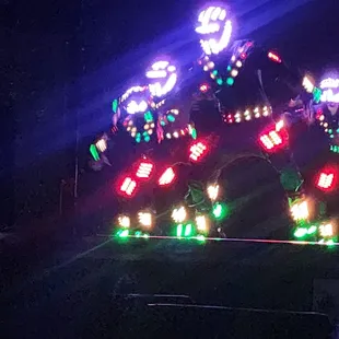 Simultaneously light spectacle dancing team.