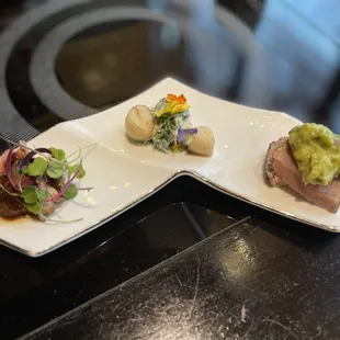 three plates of food on a table