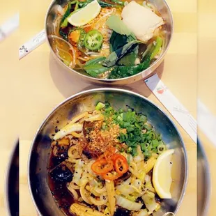 two bowls of food on a table