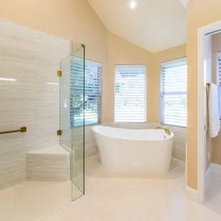 a bathroom with a bathtub and shower